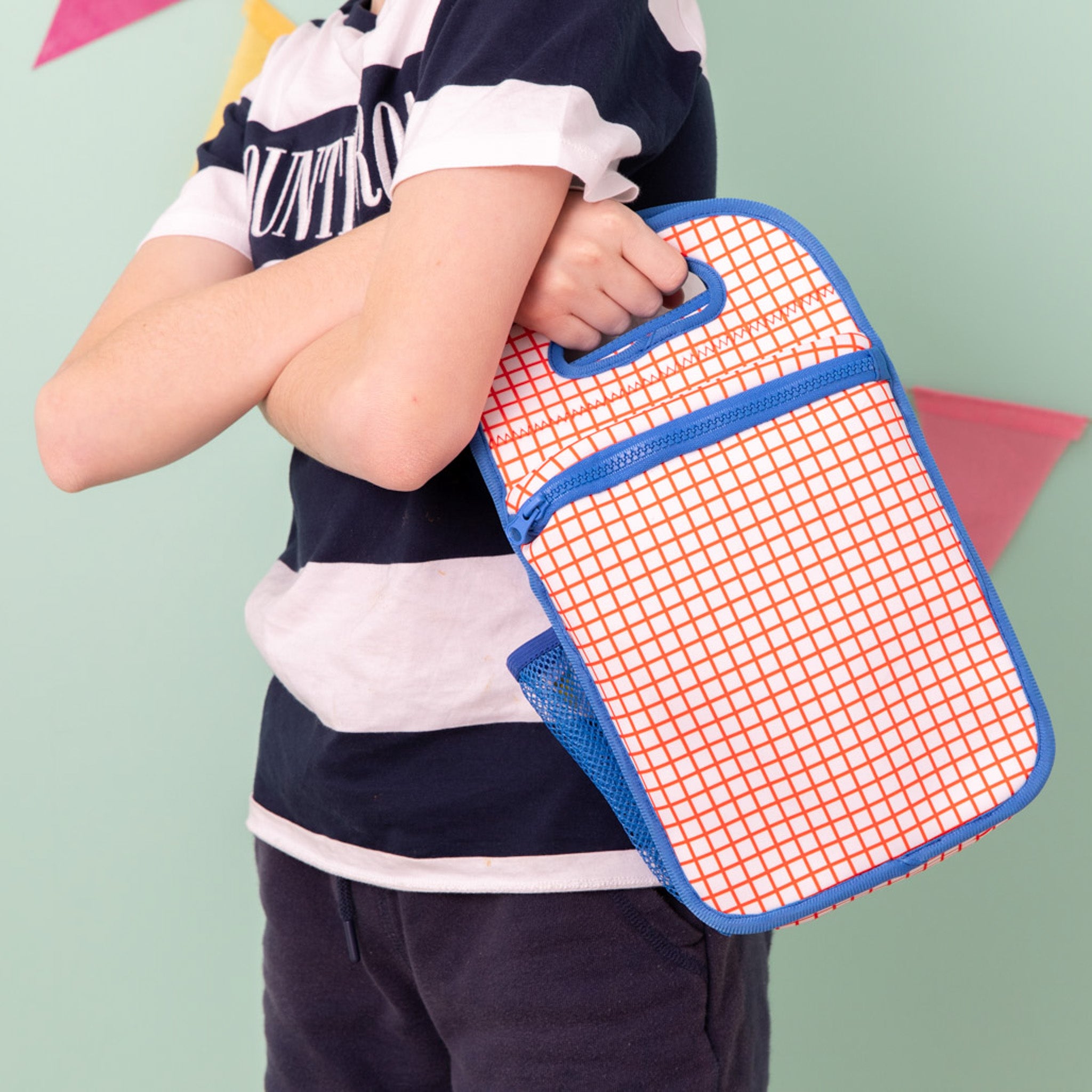 bright orange grid pattern insulated neoprene lunch bag for kids with bright blue binding - nudie rudie lunch box