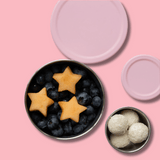 snacker pot set stainless steel with light pink silicon lid filled with snacks 