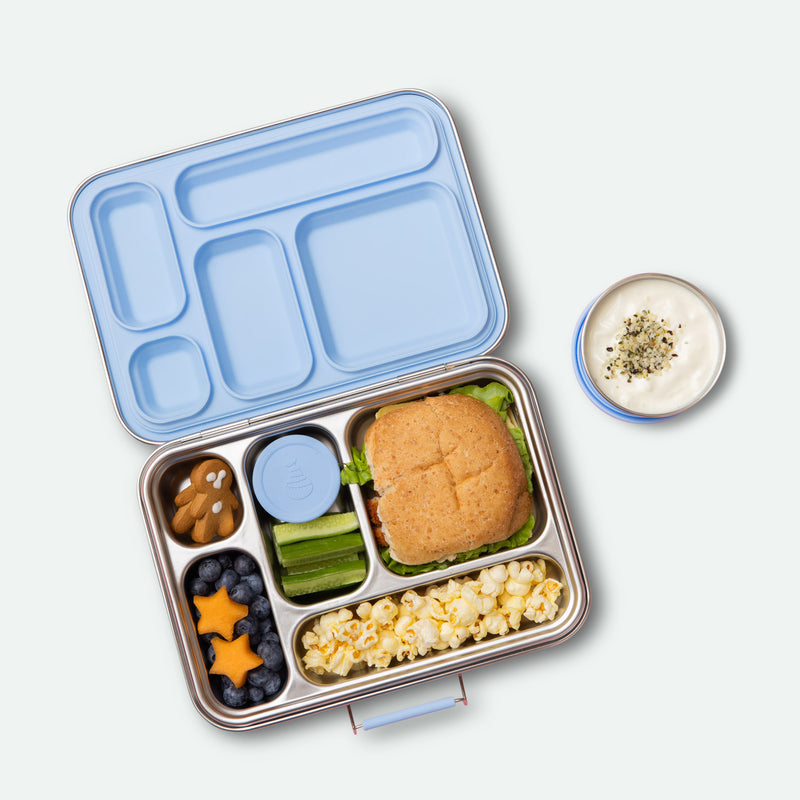 leak proof five compartment stainless steel lunch box with light blue coloured silicone seals, lids and clasp full of food
