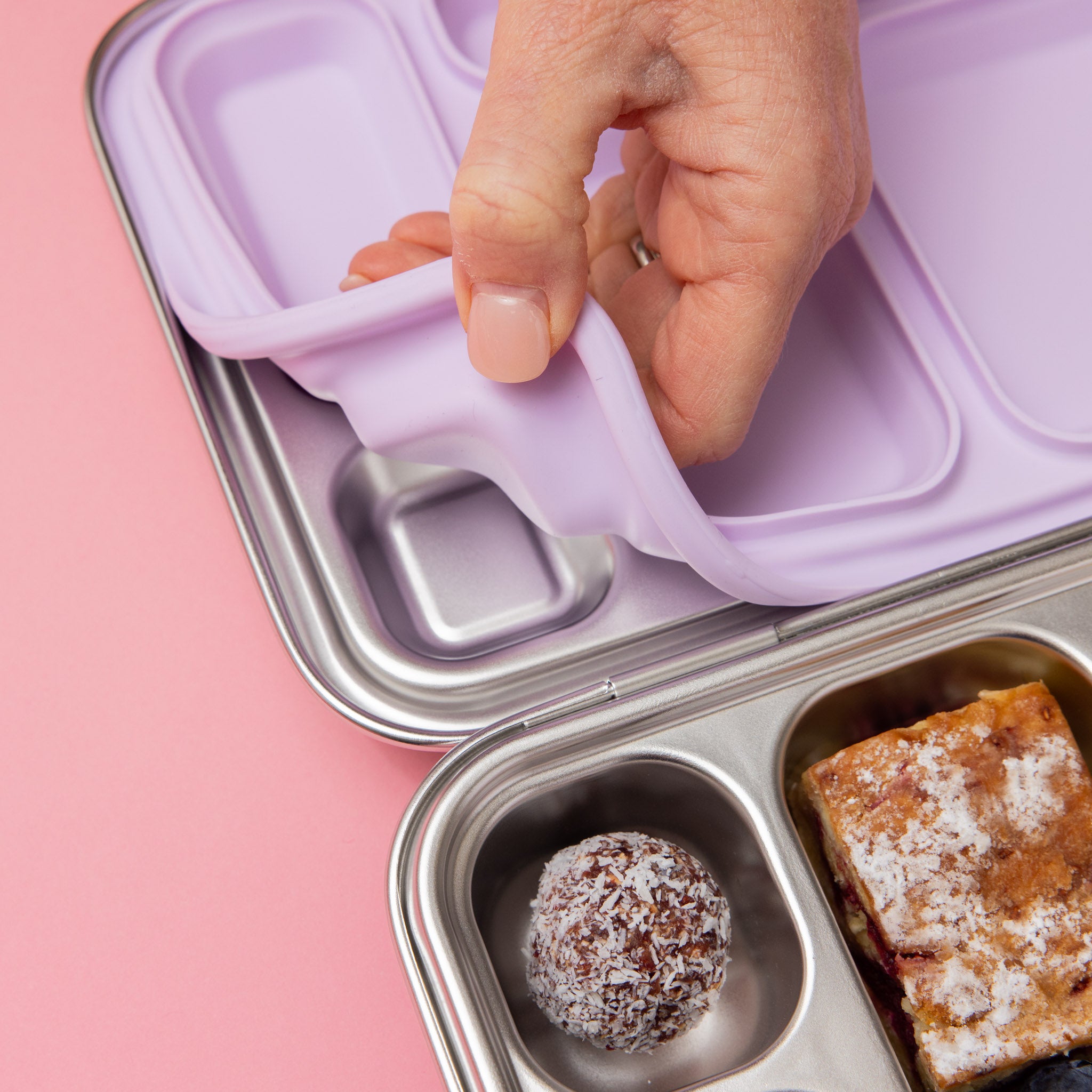 seal being removed from our soft lilac 5 compartment stainless steel lunch box
