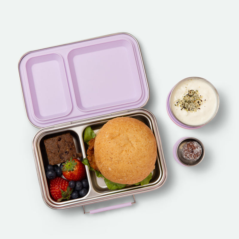 two compartment leak proof stainless steel lunch box with removable silicone seal in soft lilac full of food