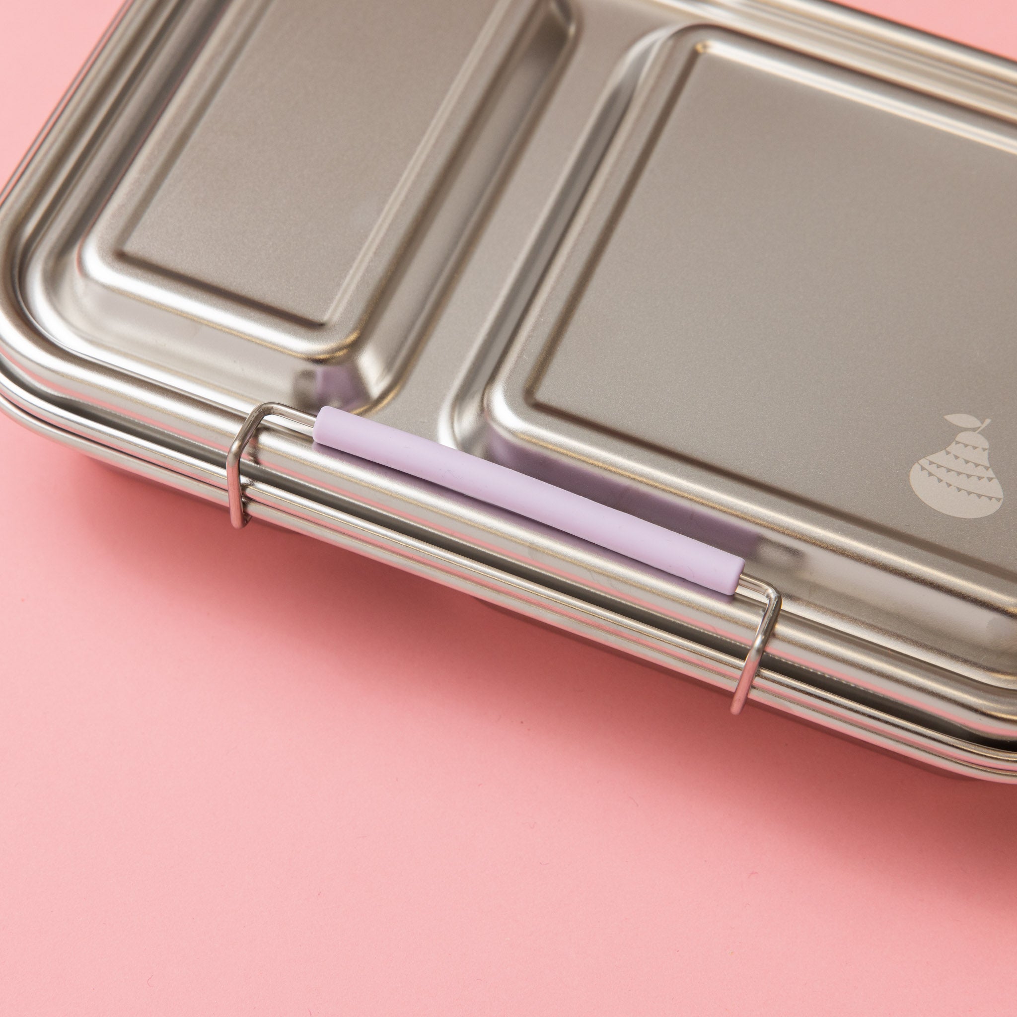 stainless steel two compartment lunch box with soft lilac/purple seals and clasp. close up of clasp