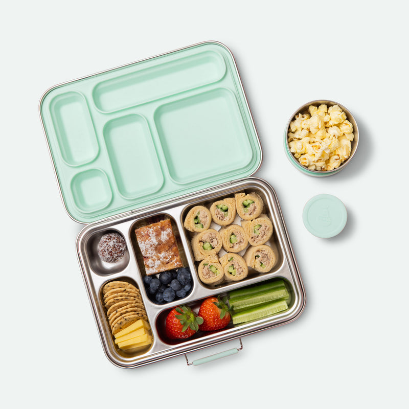 leak proof five compartment stainless steel lunch box with mint coloured silicone seals, lids and clasp full of food