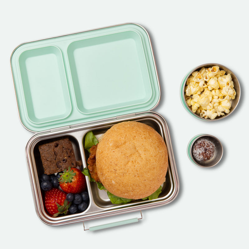 two compartment leak proof stainless steel lunch box with removable silicone seal in mint full of food