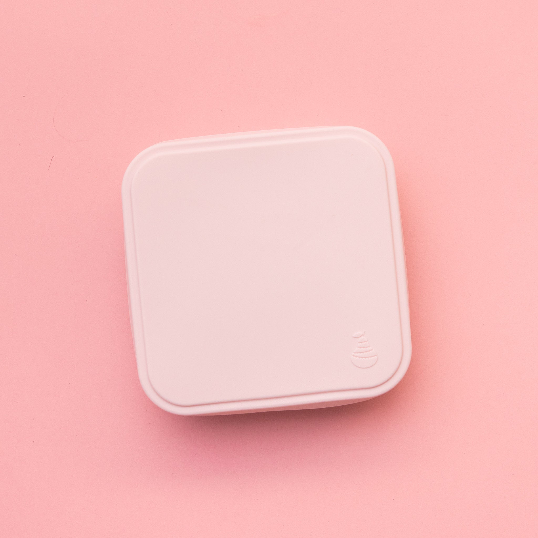 stainless steel square container or sandwich box with pink lid on a pink background with lid on showing pear logo  