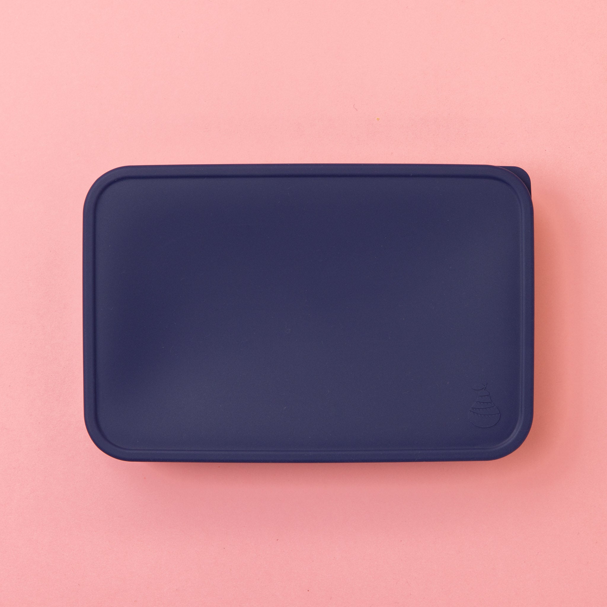 large stainless steel salad container or lunch box with navy silicone lid on pink background empty  showing pear logo on lid