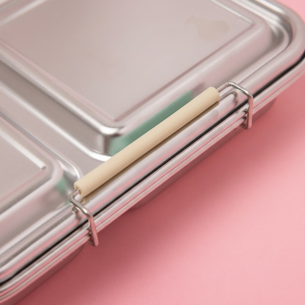 stainless steel 2 compartment lunch box up close showing oatmeal coloured silicone seal 
